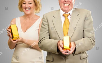 stock-photo-two-senior-couple-holding-gold-bar-on-grey-background-119053138